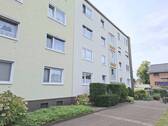 Hausansicht - Attraktive Erdgeschoss-Eigentumswohnung mit Süd-West-Balkon und Carport in Marl-Brassert!